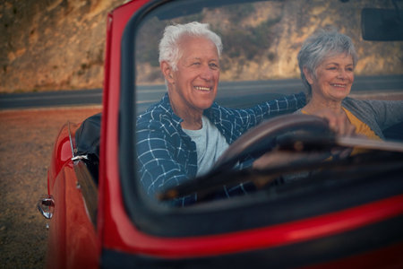 Taking their retirement years out on the road. a senior couple enjoying a road trip.の写真素材