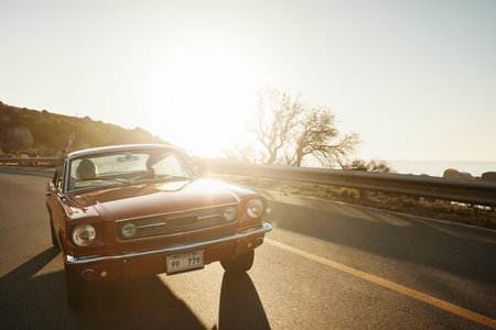 Road trips are an adventurous way to vacation. a young couple enjoying a road trip together.の写真素材