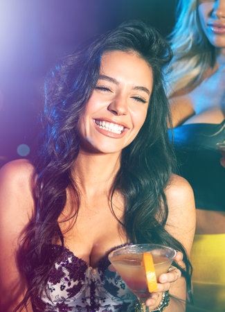 Having the time of her life. young women partying in a nightclub.の写真素材