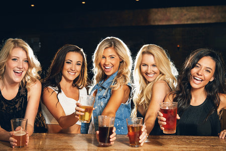 Celebrating sisterhood. young women partying in a nightclub.の写真素材
