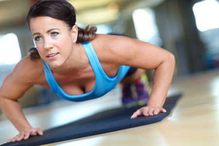 Im making great progress. A beautiful young woman working out at the gym.