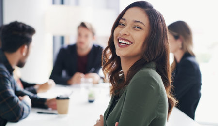 She exudes so much confidence. Portrait of a young businesswoman sitting in an office with her...