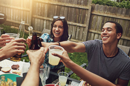 Friendship deserves to be celebrated. a group of friends having a barbecue in the yard.