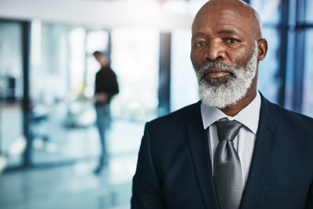 You wont regret striking out on your own. Portrait of a mature businessman standing in a modern office.の写真素材