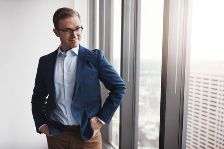 Nothing will get in my way. a professional businessman standing in an office.の写真素材