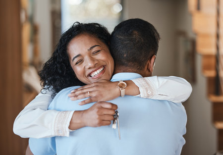 House keys, new home or happy couple hugging for real estate, property investment or apartment success. Dream, love or Indian man embracing an excited woman to celebrate goals or moving in togetherの写真素材