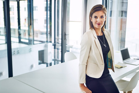 Heading up a successful business requires dedication. Portrait of a corporate businesswoman in an...