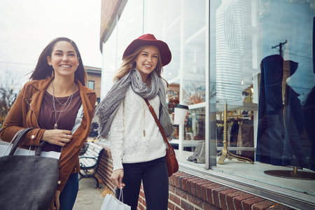 Getting in the holiday spirit. two young women out on a shopping spree.