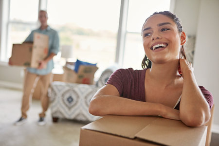 Moving house is exciting. a young couple moving into their new home.