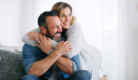 I cant wait for our date later. an affectionate couple relaxing together at home.