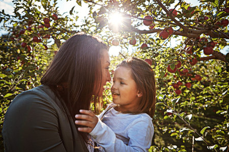 Never forget that Mommy loves you. a happy mother and daughter spending a day together in an apple...