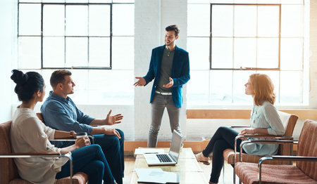 Some of the best creative minds in the business. a group of young businesspeople having a meeting in...