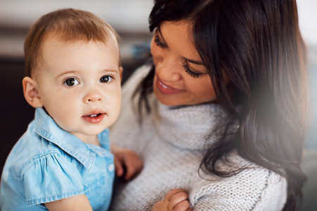 Moms my number one. an adorable baby girl bonding with her mother at home.の写真素材