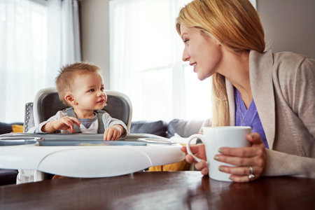 So, what are we doing next. a mother bonding with her baby boy at home.