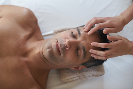 So relaxed...a mature man enjoying a relaxing masasage.の写真素材