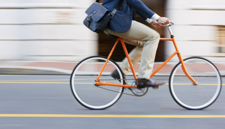 Bicycle, travel and legs of business man in a road riding to work or appointment in n a street. Carbon footprint, cycling and shoes of male on bike traveling in a city on eco friendly transportationの写真素材