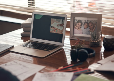 Home school home. a laptop and various other school related items on a desk at home.の写真素材