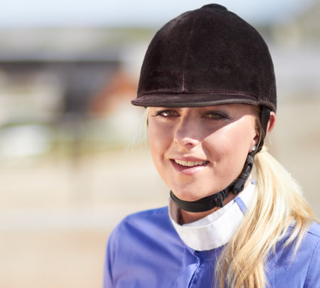 Woman smile, horse jockey and portrait of a young athlete on equestrian training ground for show and race. Outdoor, female person face and mockup on a animal farm for dressage with rider and horsesの写真素材