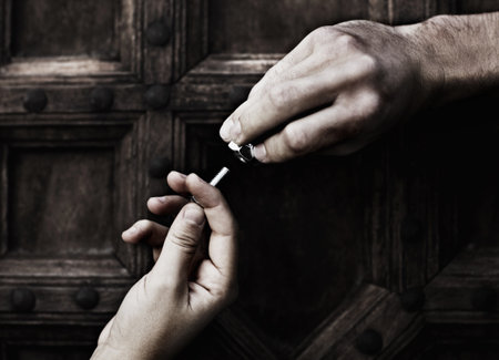Connection, nut and bolt helping hand in teamwork, diy maintenance or home renovation isolated on wood background. Giving, hands of man and woman with nuts, bolts and support, help working together.の写真素材