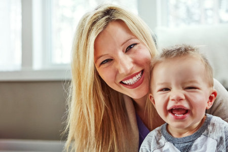 Motherhood means sleepless nights and big belly laughs. Closeup shot of a young woman spending the...