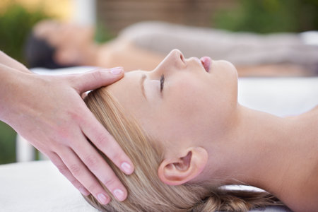 Relax, facial massage, women at reiki spa for health, wellness and luxury treatment with eyes closed. Beauty salon, professional skin care therapist and healthy face of woman with cosmetic therapy.の写真素材