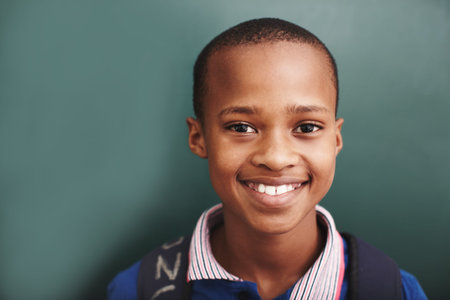 Hes the bright star in his classroom. An african american boy standing alongside copyspace at the...