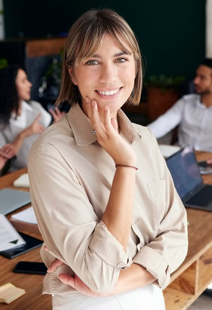 Portrait, smile and professional with a business woman intern standing in the office for coaching or development. Happy, workshop and confidence with an attractive young female employee at workの写真素材