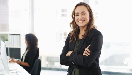 You wont find a more hardworking office. Portrait of a confident young businesswoman working in a...