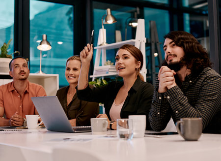 Asking for clarification is the only way to learn and grow. a businesswoman raising her hand during...