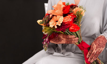 Beautiful flowers to celebrate a special day. an unrecognizable woman holding a bunch of flowers before her wedding.の写真素材