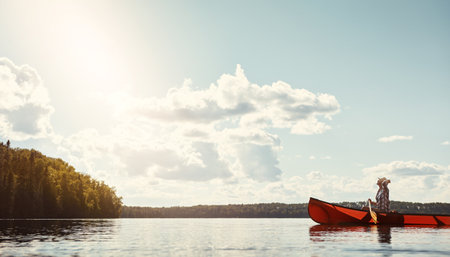 On course for adventure. an attractive young woman spending a day kayaking on the lake.の写真素材