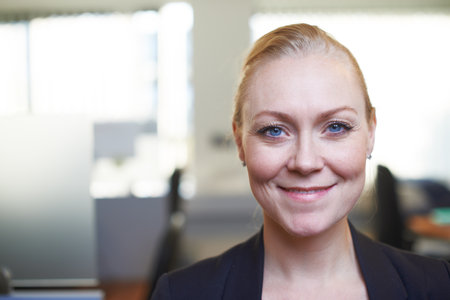 Success and confidence go hand-in-hand. Portrait of an attractive businesswoman standing in the office.の写真素材