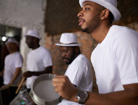 Let the rhythem move you. a band playing their percussion instruments in a Brazilian setting.