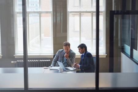 Theyll achieve success together. businessmen working in their office.の写真素材