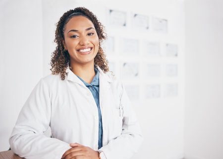 Portrait, doctor or happy woman in healthcare hospital with smile, pride or trusted medical advice to help. Life insurance, wellness or face of cardiology expert smiling or working in a clinic officeの写真素材