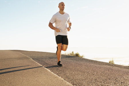 He lives for his daily run. a young runner training outdoors.