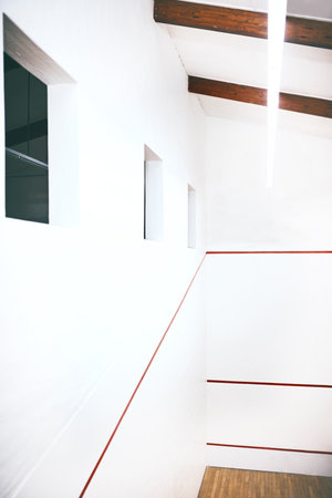 Lighting the way towards your goals. an empty squash court.の写真素材