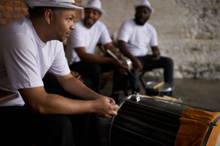 Percussion is their passion. band members sitting with their instruments.