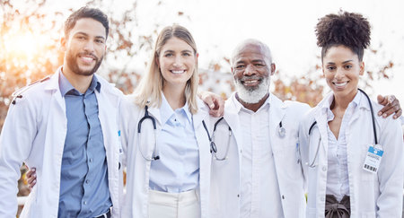 Doctors, hug together and group portrait for motivation, success or team building at hospital. Men,...