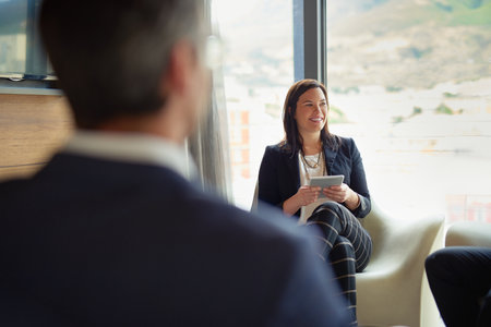 Business is a process. three businesspeople talking in a corporate office.の写真素材