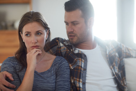 Relationships are about appreciating the similarities and accepting the differences. a young married couple having a disagreement in the living room at home.の写真素材