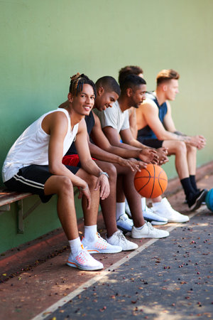 These guys have become my best buddies forever. Portrait of a sporty young man taking a break with...