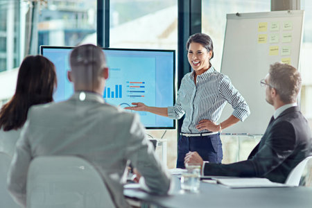 She has more than just a well written presentation. a businesswoman delivering a presentation in the...