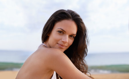 At home on the beach. Cropped portrait of a beautiful young woman on the beach.の写真素材