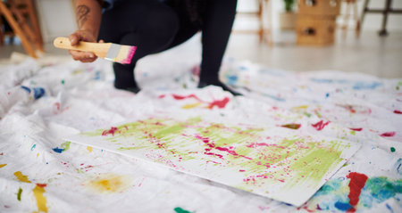 Everything you create is art. an unrecognizable woman painting in a art studio.の写真素材
