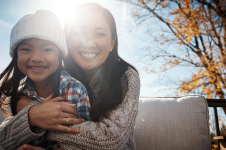 Cozy autumn days are for snuggles and cuddles. Portrait of an adorable little girl enjoying an...