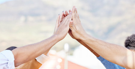 People, friends and high five hands for support, solidarity and teamwork of target, agreement and trust. Closeup group, partnership and collaboration of community celebration, motivation and winningの写真素材