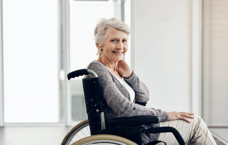 This is me in my senior years. a senior woman sitting in a wheelchair.の写真素材