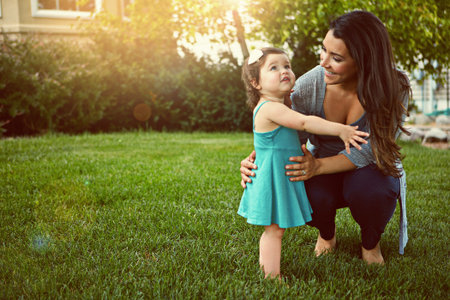 Children give a million more reasons to enjoy life. a mother bonding with her adorable little...