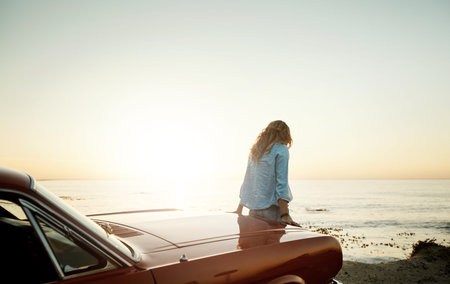 Go on adventures that fill your soul. a young woman enjoying a road trip along the coast.